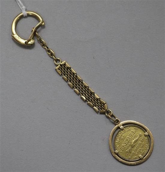 A Caciques de Venezuala Guaicaipuro 1957 gold coin, mounted on an 18ct gold key ring,